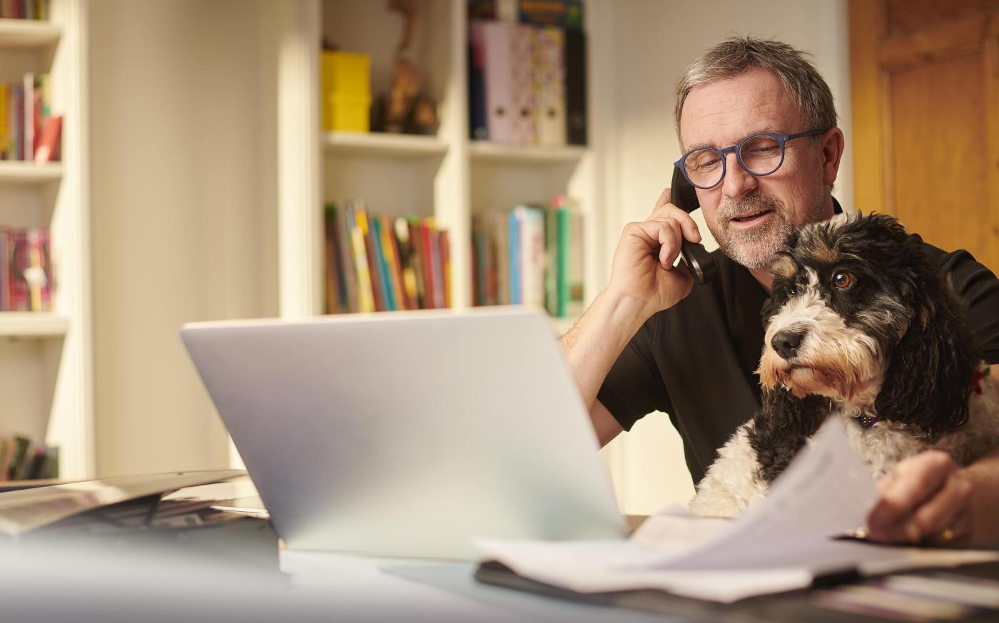 Man at desk with pet