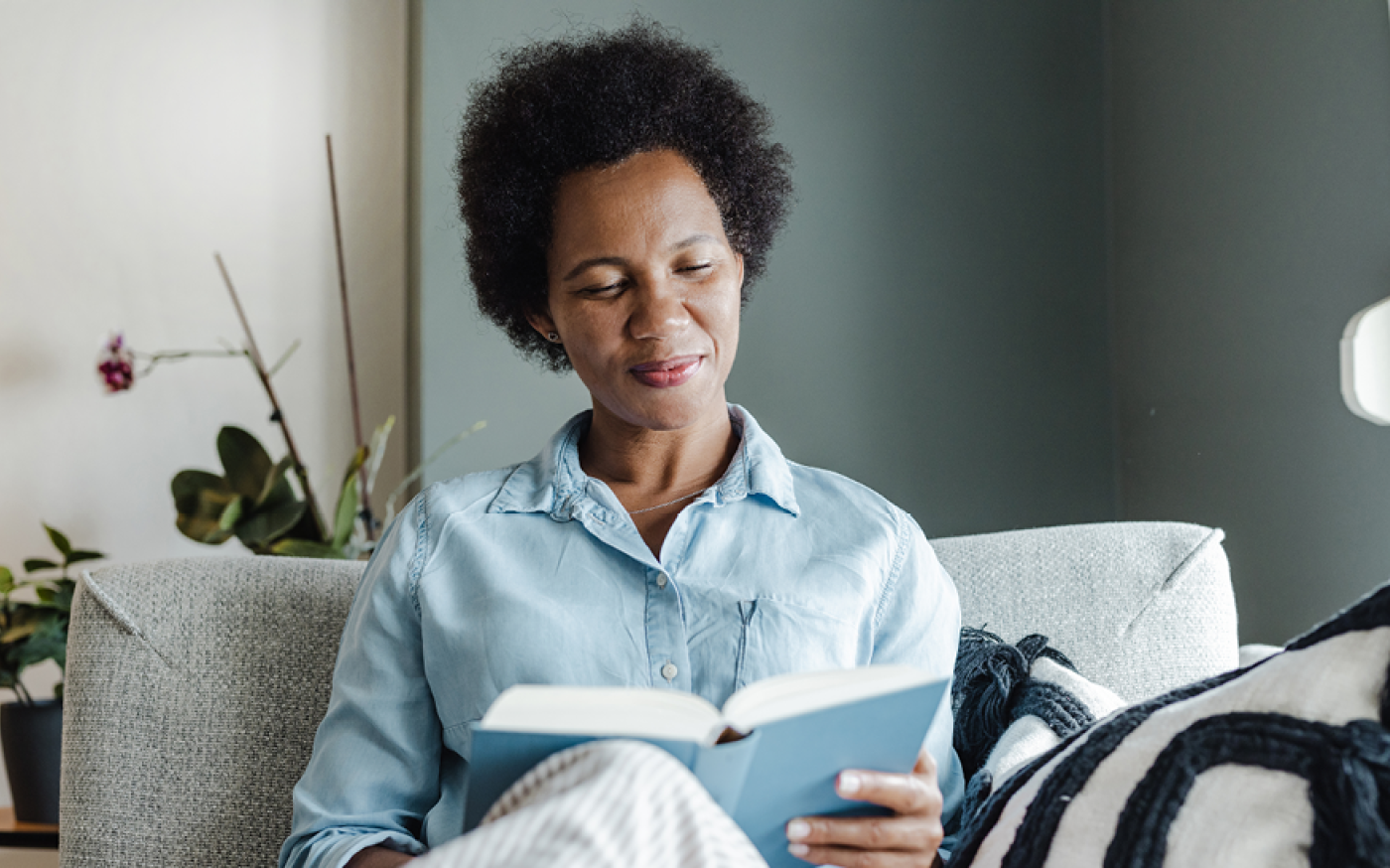 woman reading on a couch