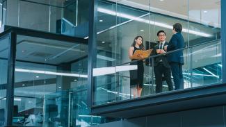 a group of business people chatting