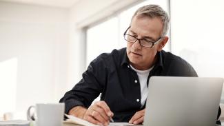 Man at desk with laptop